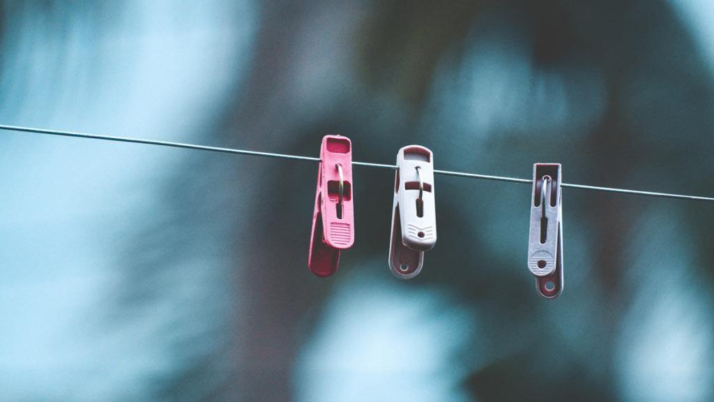 three clothespins on a clotheline